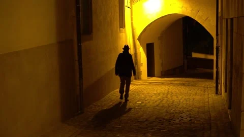 man walking alone at night