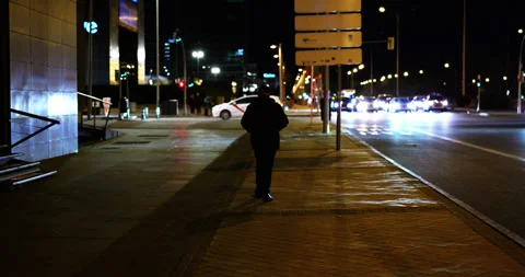 Older Man Walking Through Cinematic Night Stock Footage 299640596