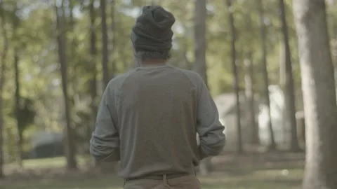 Older man walks through a backyard Stock-Footage 146196868