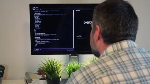 Older Office Worker AI Vibe Coding in Home Office Stock Footage 325326831