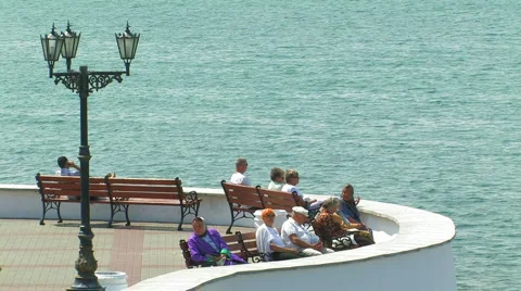 Older persons have a rest on quay. Stock-Footage 5296955