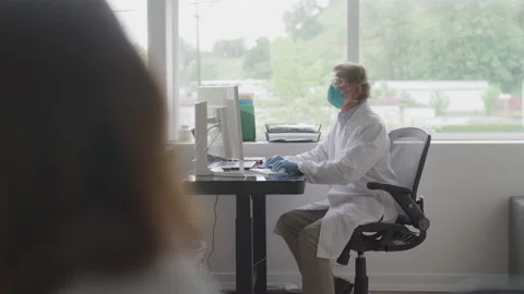 Older Research Scientist Analyzes Data on Laboratory Computer in Window Light Stock Footage 208766346
