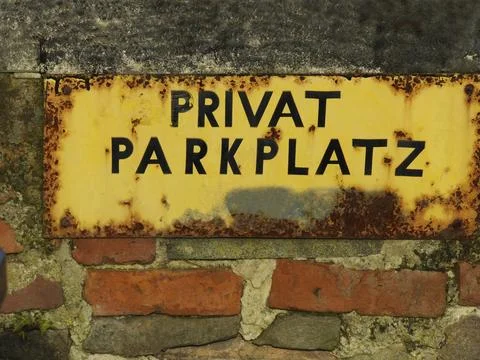 Older, somewhat rusty, sign with the print Stock Photos