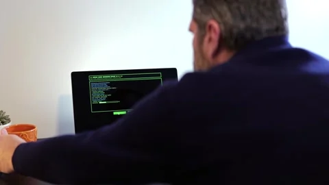 Older Systems Admin Restores Backup After Hack Stock Footage 326150559