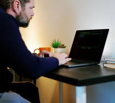 Older Systems Admin Restores Backup After Hack Stock Photos