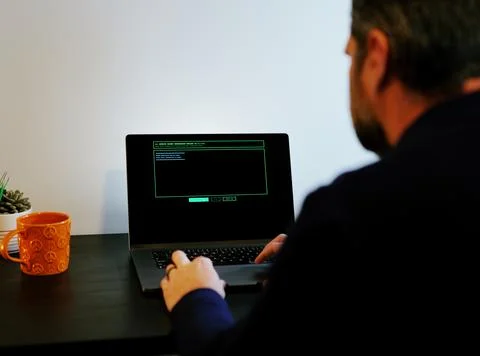 Older Systems Admin Restores Backup After Hack Stock Photos