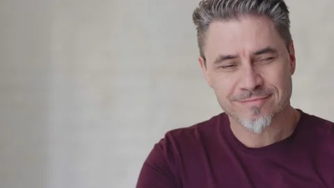Older white man looking up to camera and smiling Video stock 132917673