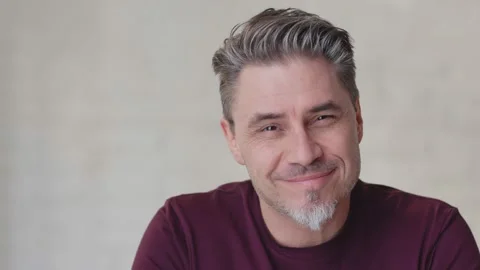 Older white man looking up to camera and smiling Stock Footage 143115612