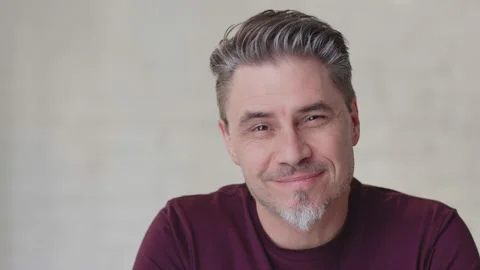 Older white man looking up to camera and smiling Stock Footage 148430763