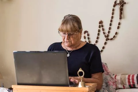 Older woman using her devices with new technologies at home Stock Photos