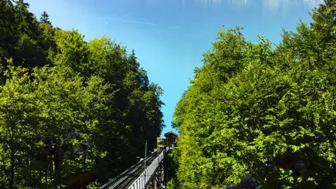 Oldest Cable Train in Europe in Giessbach with Lake Brienz and Mountain Stock Footage 264576285