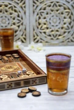 Oldest known board games Backgammon with cups of tee. Stock Photos