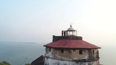 Oldest lighthouse tower in India in sunset. Aerial view. 스톡 동영상 85102428