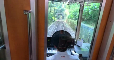 The oldest train in Japan is going up the mountains in Hakone. Train driver view Stock Footage 259309476