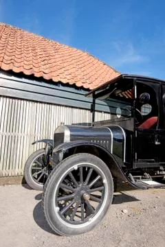 Oldtimer car in a blue sky Stock Photos