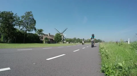 Oldtimer motorbikes motorcycles four stroke engines driving past Video stock 53797654