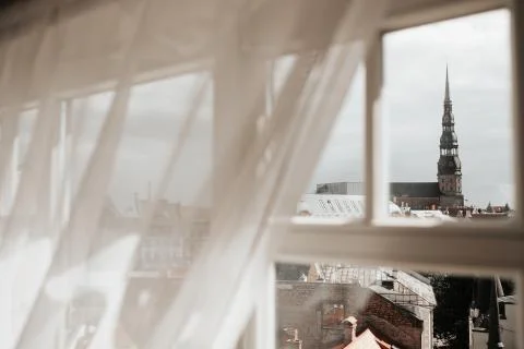 Oldtown from a window with curtains Stock Photos