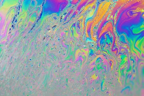 Oli drop on a water surface makes a beautilful color picture Stock Photos