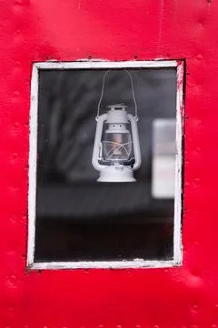 Oli lamp in a window Stock Photos