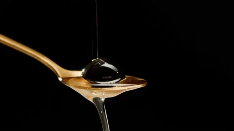 Olive on black background close-up. Falling water drops on olive. Stock Footage 195530676