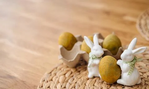 Olive-colored Easter eggs arranged on a rustic wooden table Foto stock