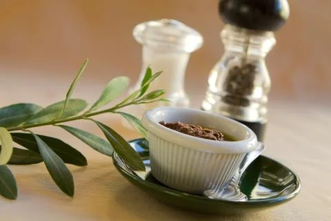 Olive dip with leaves Stock Photos