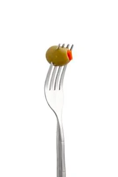 Olive fruit on fork Stock Photos