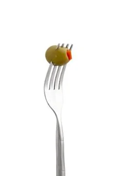 Olive fruit on fork Foto stock