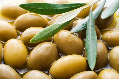 Olive fruit with leaves close up Stock Photos