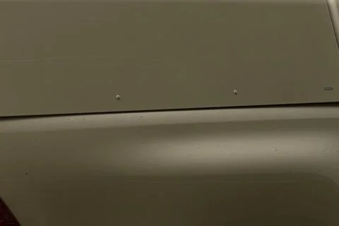 Olive green car trunk with rivets and panel lines Stock Photos