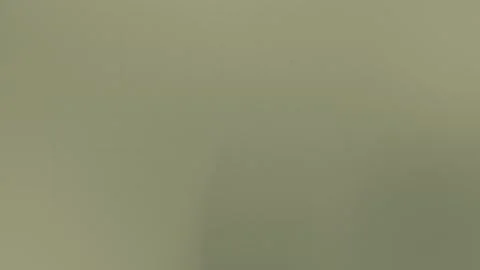 Olive green grainy texture with subtle grid lines creates a seamless loop 動画素材 309058605