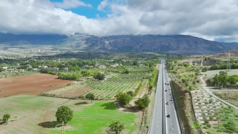 Olive groves and fields over Road E45, Castrovillari, Cosenza, Calabria, Italy Stock Footage 294952498