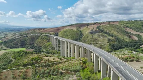 Olive groves and fields over Road E45, Castrovillari, Cosenza, Calabria, Italy Video stock 294953228