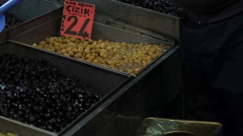 Olive maker puts olives on the counter Stock Footage 170658785