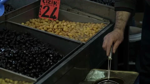 Olive maker puts olives on the counter Stock Footage 170659022