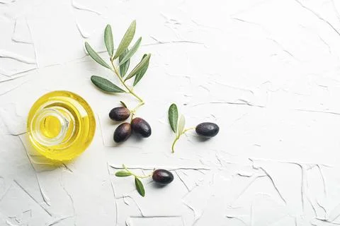 Olive oil background with bottle Stock Photos