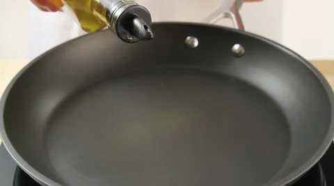 Olive oil being added to a pan 스톡 동영상 24662876