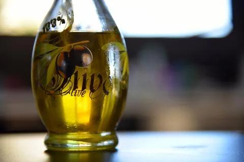Olive oil in bottle Stock Photos