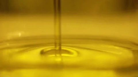 Olive Oil in bottle slow motion (macro lens) Stock Footage