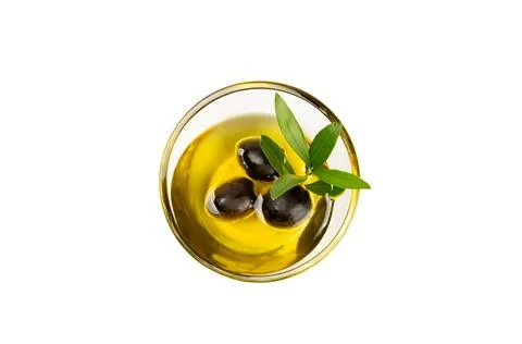Olive oil in a bottle on texture background. Stock Photos