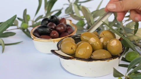 Olive oil flows through the olive Stock Footage 118210076