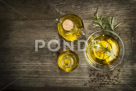 Olive oil with herbs. Stock Photos