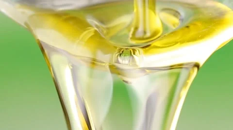 Olive oil pouring on a spoon Stock Footage 67712519