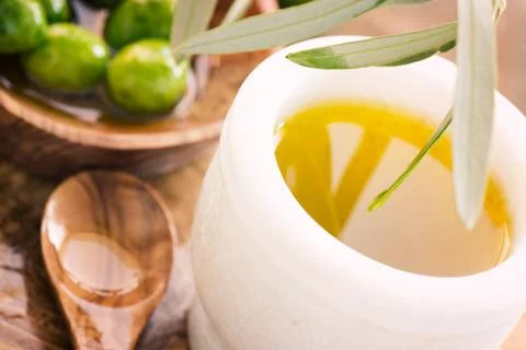 Olive oil on rustic background Stock Photos