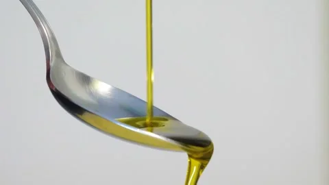 Olive oil on a spoon Video stock 165766027