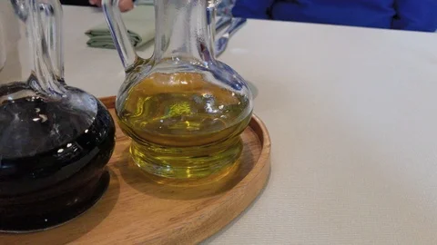 Olive oil on a table in a restaurant. 库存影片 124956993