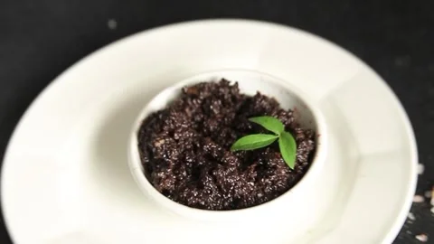 Olive tapenade appetizer black olive pâté food preparation tasty snack Stock Footage 337964242