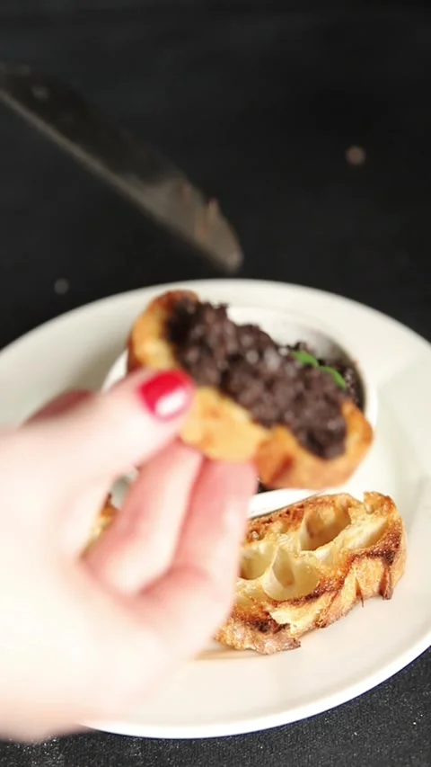 Olive tapenade appetizer black olive pâté food preparation tasty snack Stock Footage 337964266