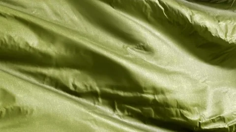 Olive textile fabric waving on the wind background. Solid Color Tone. Full fi Stock Footage 197428802
