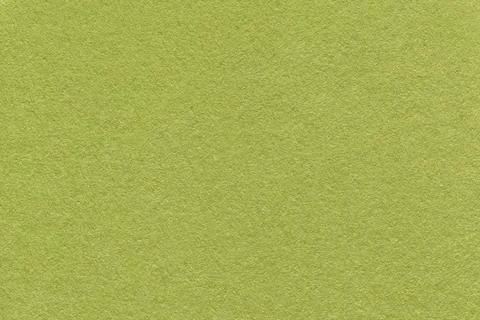 Olive textured paper background with subtle grain surface and soft structure. Stock Photos